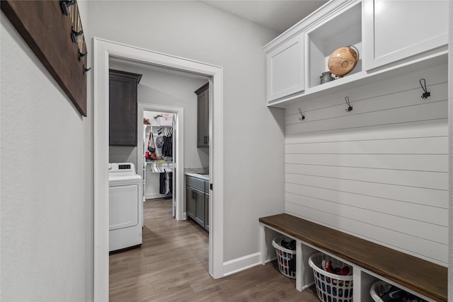 mudroom featuring washer / dryer and dark wood-type flooring