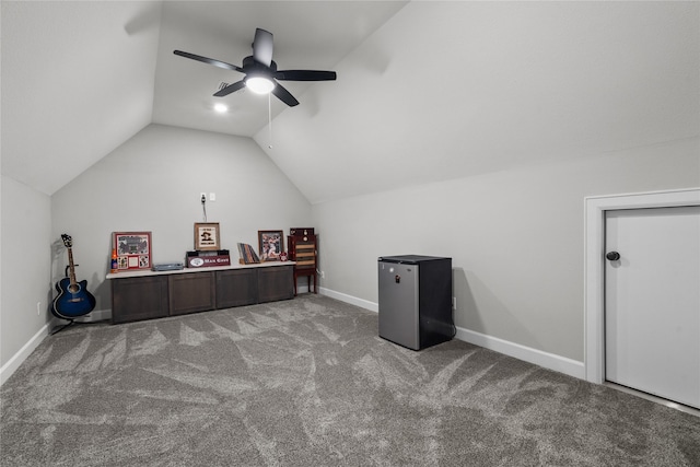 office space featuring ceiling fan, light colored carpet, and lofted ceiling