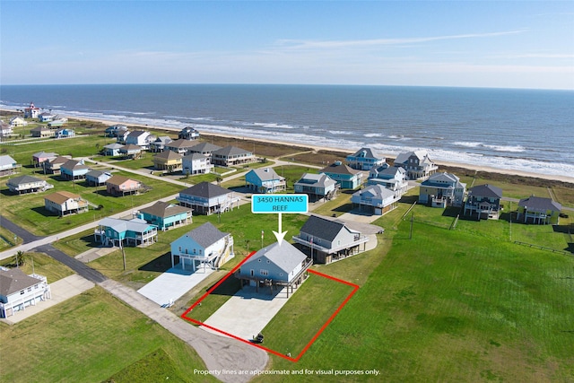 bird's eye view with a beach view and a water view