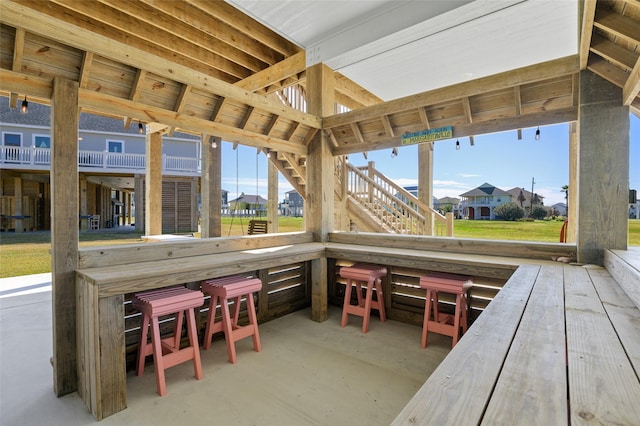 sunroom featuring vaulted ceiling