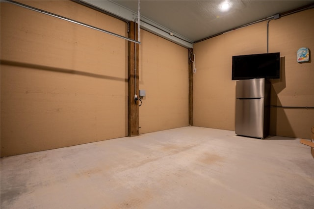 garage featuring stainless steel refrigerator