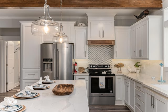 kitchen featuring light stone countertops, appliances with stainless steel finishes, white cabinetry, and decorative backsplash