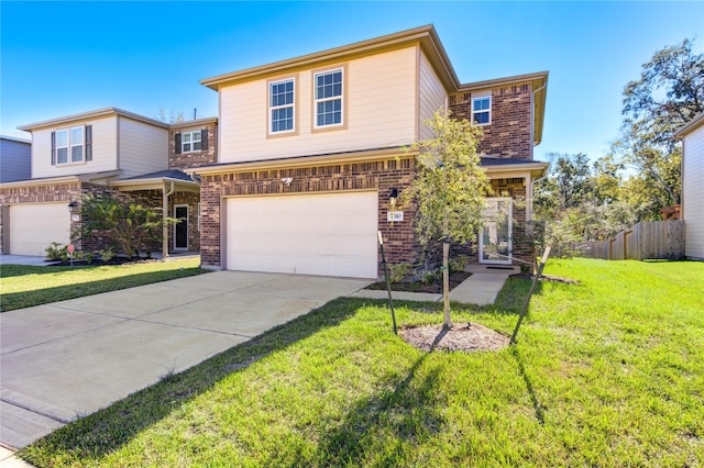 view of property with a front yard and a garage