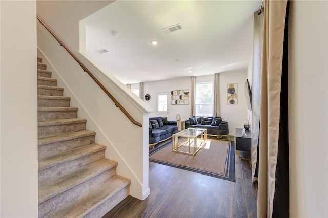 living room featuring dark hardwood / wood-style flooring