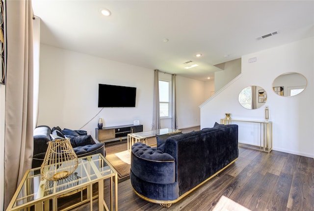 living room with dark hardwood / wood-style floors