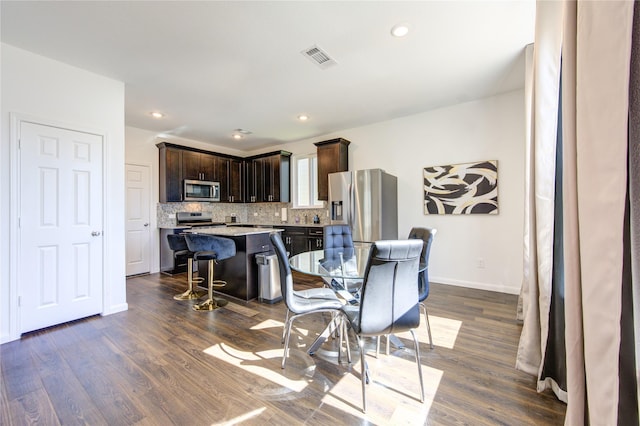 dining room featuring dark hardwood / wood-style flooring