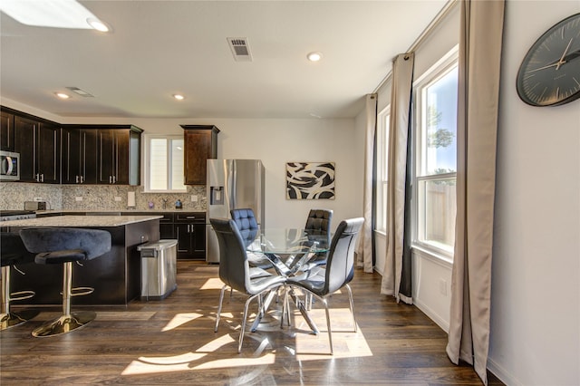 dining room featuring dark hardwood / wood-style flooring