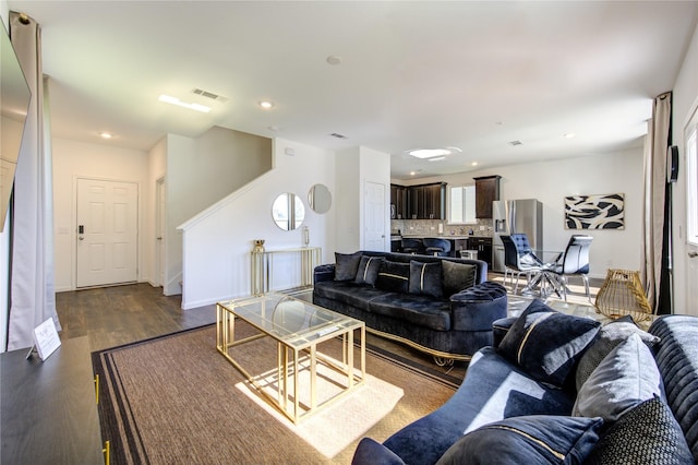 living room featuring dark wood-type flooring