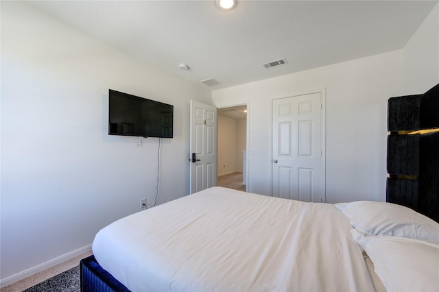 bedroom with a closet and carpet floors