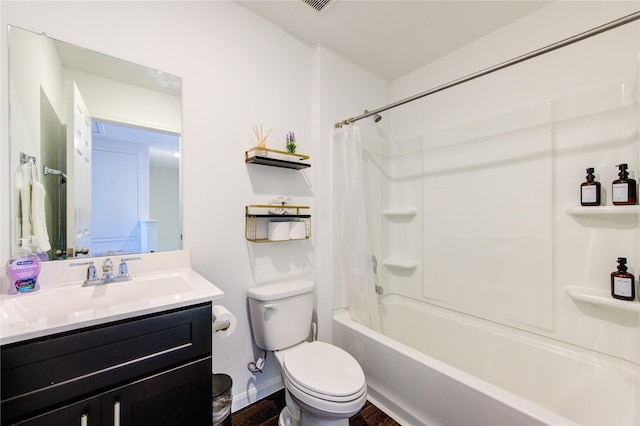 full bathroom featuring hardwood / wood-style flooring, shower / bath combination with curtain, vanity, and toilet