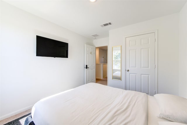 bedroom with a closet and carpet flooring