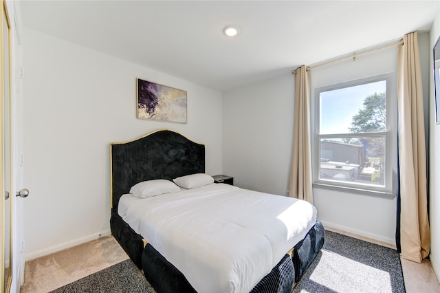 bedroom with light colored carpet