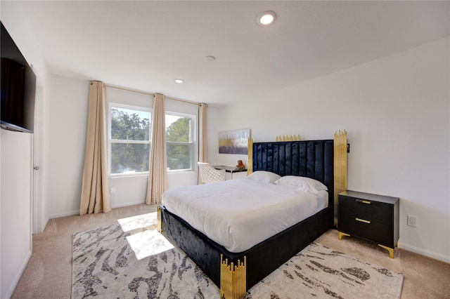 bedroom featuring light colored carpet