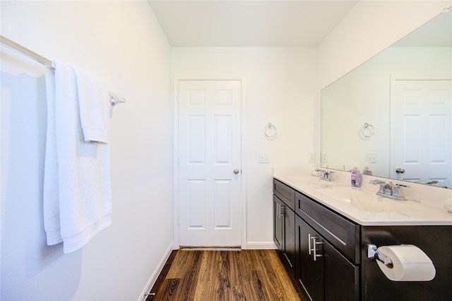 bathroom featuring vanity and hardwood / wood-style flooring