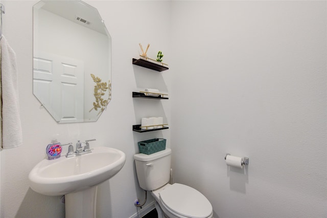 bathroom featuring sink and toilet