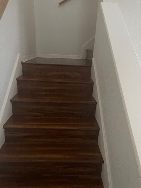 staircase featuring hardwood / wood-style floors