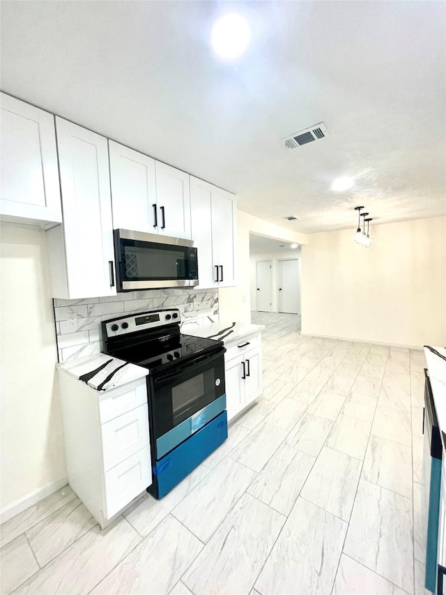 kitchen featuring white cabinetry, decorative light fixtures, electric stove, and decorative backsplash