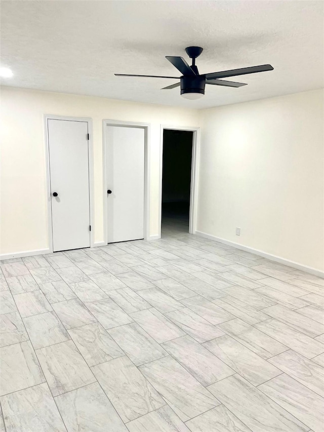 unfurnished room with ceiling fan