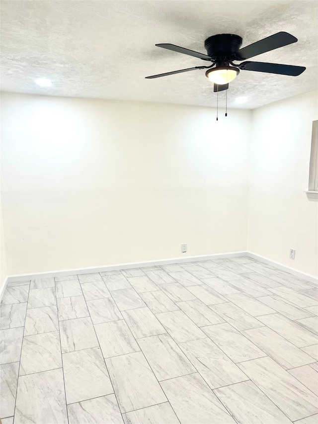 unfurnished room featuring ceiling fan