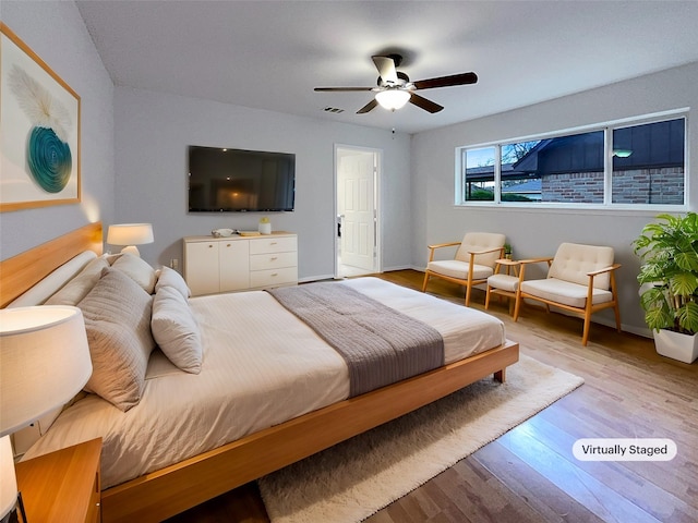 bedroom featuring ceiling fan and light wood-type flooring