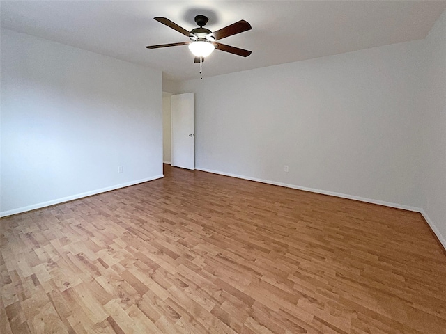 unfurnished room with light wood-type flooring and ceiling fan