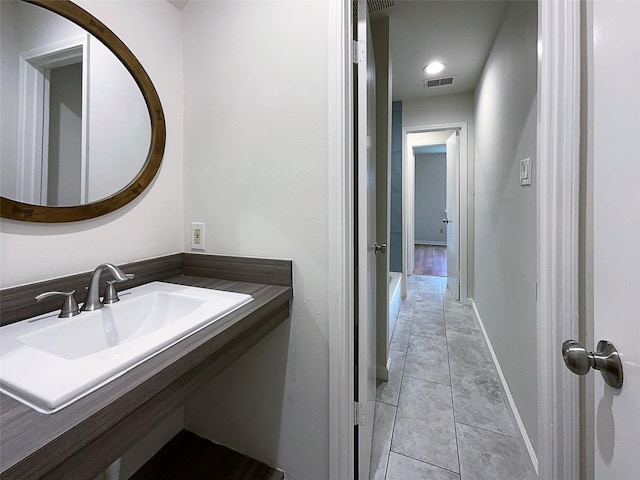 bathroom featuring sink and tile patterned floors