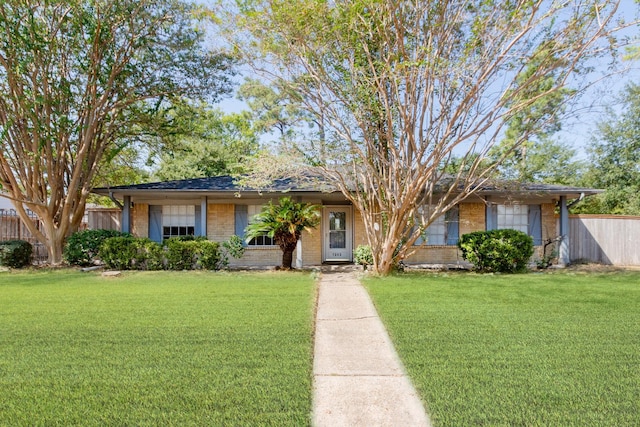 ranch-style house featuring a front lawn