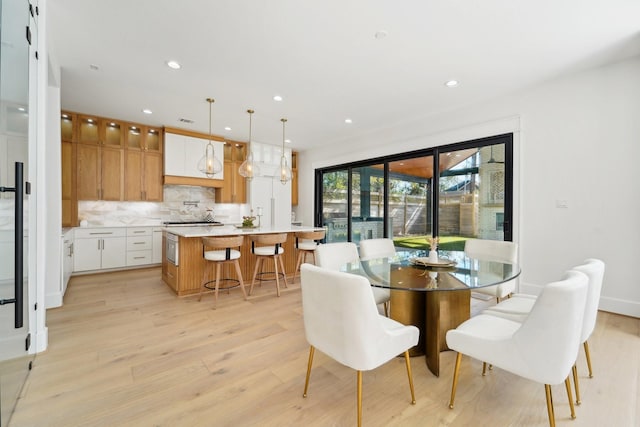 dining area with light hardwood / wood-style flooring