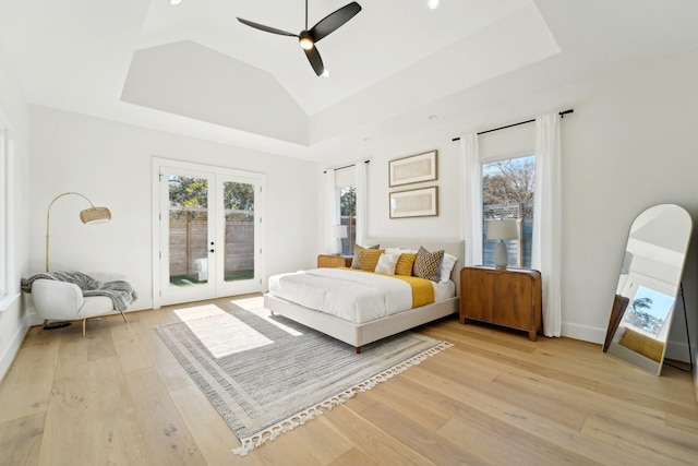 bedroom featuring ceiling fan, french doors, light hardwood / wood-style flooring, and access to exterior