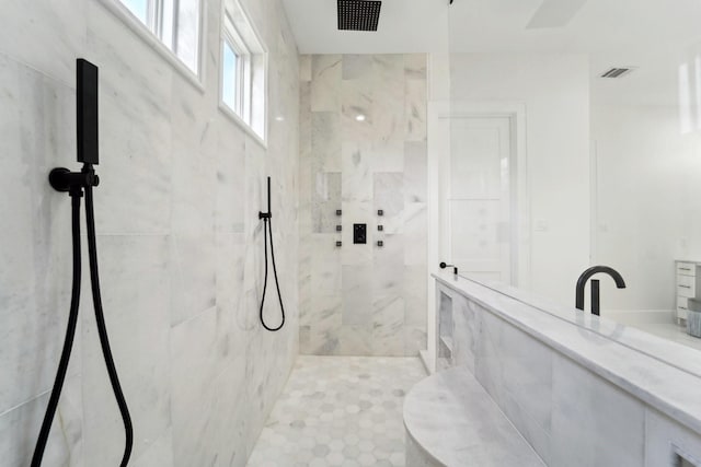 bathroom featuring a tile shower