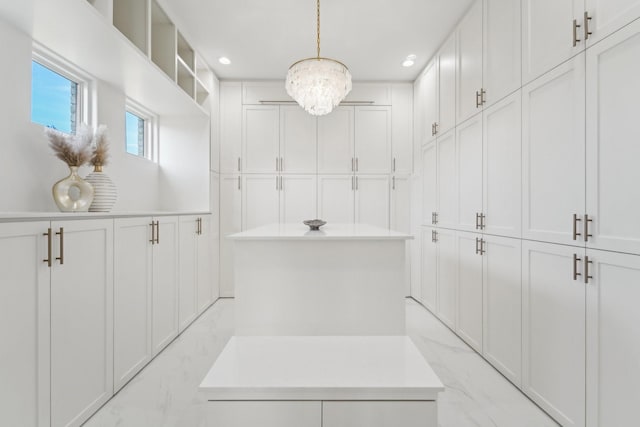 bathroom featuring a notable chandelier