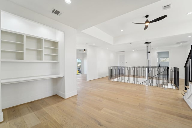 hall featuring light hardwood / wood-style floors and plenty of natural light