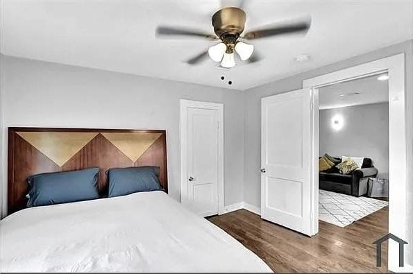 bedroom featuring ceiling fan and hardwood / wood-style floors