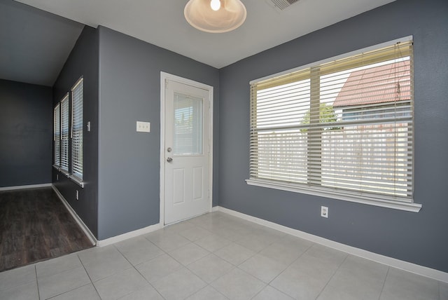 entrance foyer featuring light tile patterned flooring