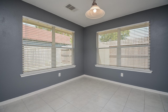 unfurnished room featuring light tile patterned floors