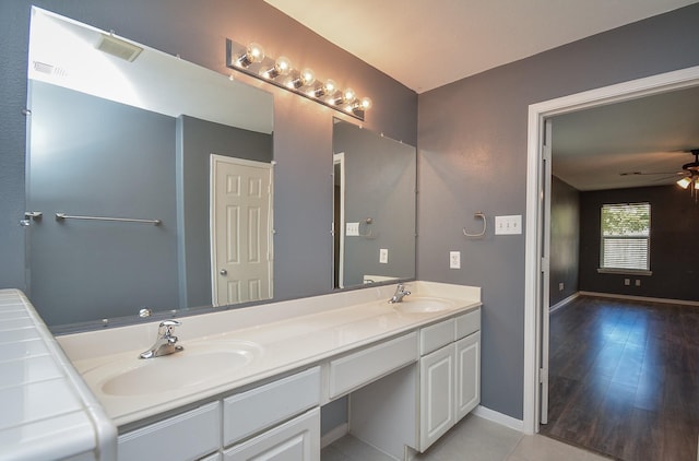 bathroom featuring ceiling fan, tile patterned floors, and vanity