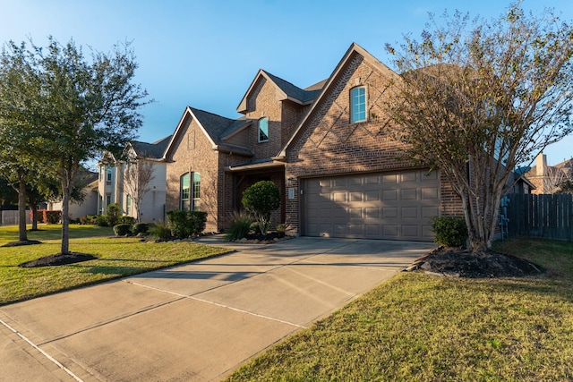 front of property featuring a garage and a front yard