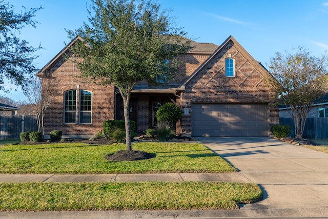 front of property featuring a front lawn and a garage