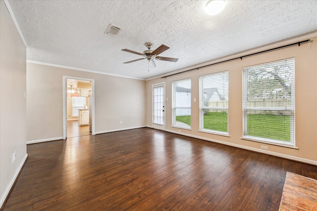 spare room featuring dark hardwood / wood-style flooring, a textured ceiling, ceiling fan, and crown molding