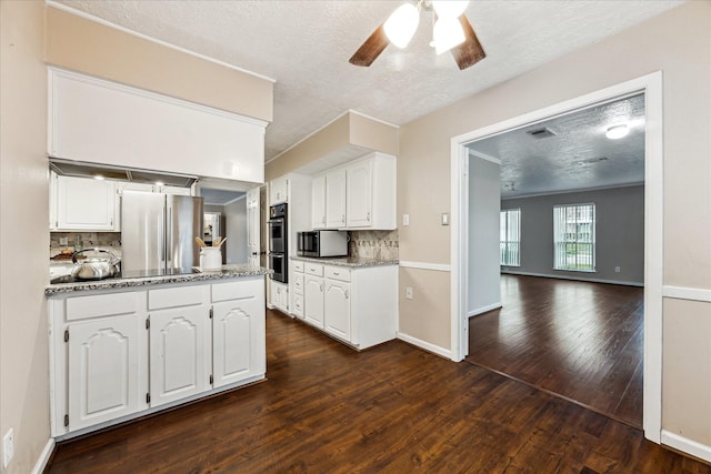 kitchen with white cabinetry and decorative backsplash