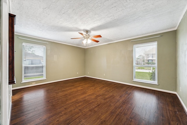 unfurnished room with a healthy amount of sunlight, crown molding, and dark hardwood / wood-style floors