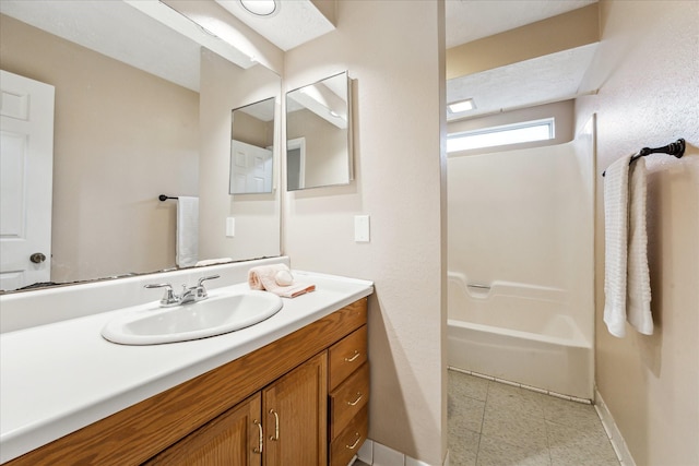 bathroom with shower / bath combination and vanity