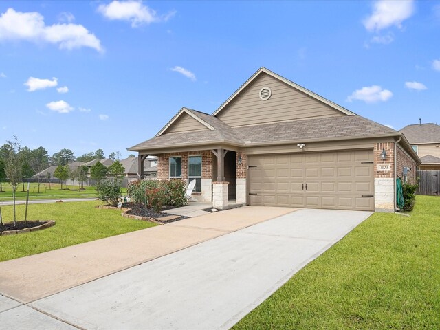 view of front of home with a garage, covered porch, and a front lawn