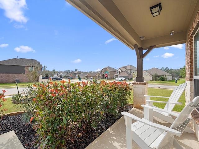 view of patio / terrace featuring a porch and a residential view