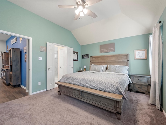 bedroom with ceiling fan, baseboards, vaulted ceiling, and carpet flooring