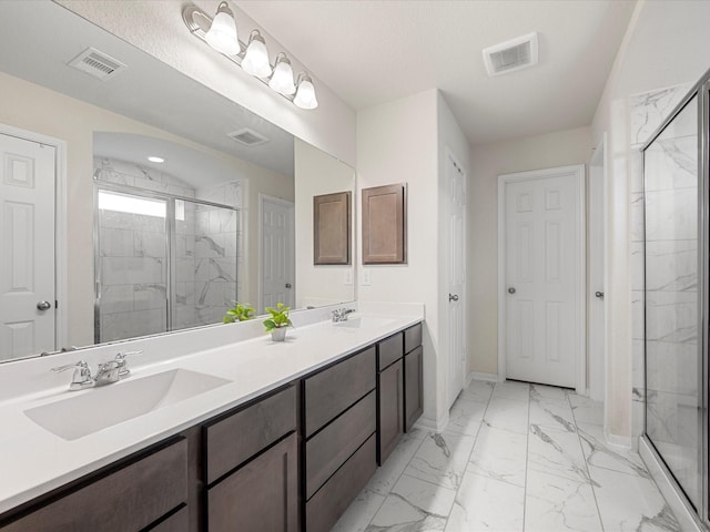 bathroom featuring visible vents, a sink, and a marble finish shower