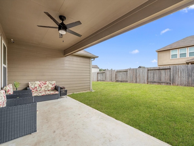 view of yard featuring a patio, a fenced backyard, and a ceiling fan