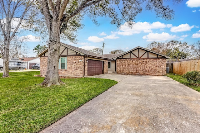 view of front of home with a front lawn and a garage