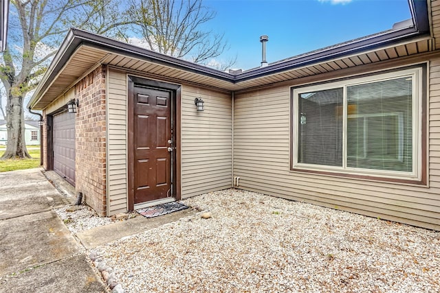 entrance to property featuring a garage