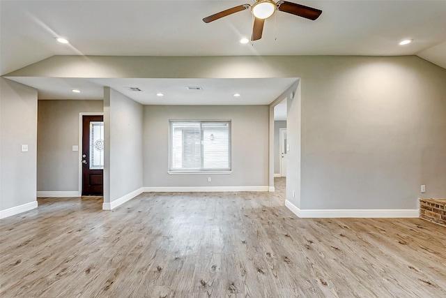 unfurnished room with light hardwood / wood-style floors, ceiling fan, and vaulted ceiling